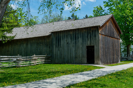Toronto, ON, Canada â May 15, 2022: View the over forty 19th-century buildings in the open-air heritage museum Black Creek Pioneer Village in Toronto, Ontario, Canada. The village is a recreation of life in 19th-century Ontario and gives an idea of how のeditorial素材