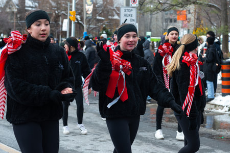 Toronto, ON, Canada â€“ November 20, 2022: People take part in the 118th Toronto Santa Claus...