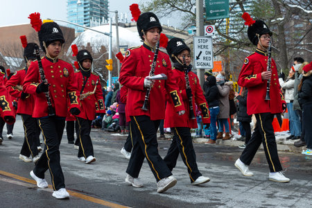 Toronto, ON, Canada â€“ November 20, 2022: People take part in the 118th Toronto Santa Claus...