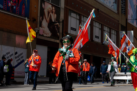 Toronto, ON, Canada â€“ March 20, 2022: People Take Part in the St Patrick's Day Parade in...