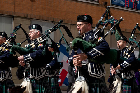 Toronto, ON, Canada â€“ March 20, 2022: Drummers and Pipers Take Part in a St Patrick's Day...