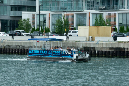 Toronto, ON, Canada - August 21, 2022: View a water taxi boat on Ontario lake near Downtown Torontoのeditorial素材