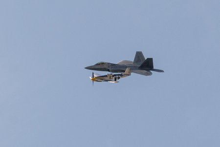Toronto, ON, Canada â September 2, 2017:  U.S. Air Force F-22 Raptor and P-51 Mustang fly together during the 2017 Canadian International Air Show in Torontoのeditorial素材