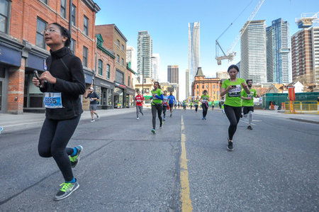 Toronto, ON, Canada -  May 13, 2018: Runners take part in the Run 2018 Sporting Life 10k competition in Downtown Torontoのeditorial素材