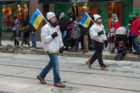 Toronto, ON, Canada â March 19, 2023: People Take Part in the St Patrick's Day Parade in Downtown Toronto Saint Patrick's Day is a Religious Holiday Celebrated Internationally on 17 Marchのeditorial素材