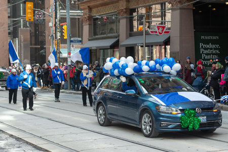 Toronto, ON, Canada â March 19, 2023: People Take Part in the St Patrick's Day Parade in Downtown Toronto Saint Patrick's Day is a Religious Holiday Celebrated Internationally on 17 Marchのeditorial素材