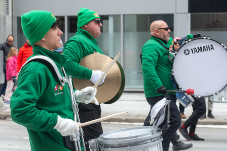 Toronto, ON, Canada â March 19, 2023: People Take Part in the St Patrick's Day Parade in Downtown Toronto Saint Patrick's Day is a Religious Holiday Celebrated Internationally on 17 Marchのeditorial素材