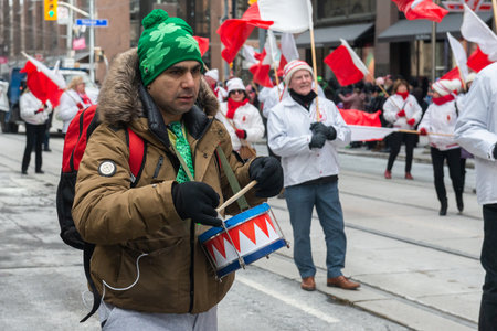 Toronto, ON, Canada â March 19, 2023: People Take Part in the St Patrick's Day Parade in Downtown Toronto Saint Patrick's Day is a Religious Holiday Celebrated Internationally on 17 Marchのeditorial素材