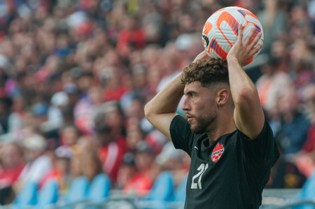 Toronto, ON, Canada - June 27, 2023: Jonathan Osorio #21 holds the ball during the  2023 Concacaf Gold Cup match between national team of Canada and Guadeloupe (Group D) (Score 2:2)のeditorial素材