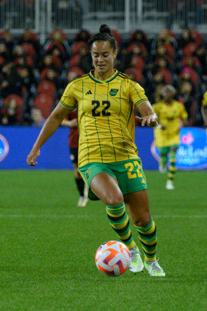 Toronto, ON, Canada - September 26, 2023: Kayla McKenna  #22 of the Jamaica national football team moves with the ball during the 2023 Concacaf W Olympic Play-In match between women national team of Canada and  Jamaica (Score 2:1)のeditorial素材