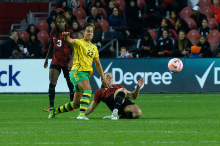 Toronto, ON, Canada - September 26, 2023: Kayla McKenna  #22 of the Jamaica national football team moves with the ball during the 2023 Concacaf W Olympic Play-In match between women national team of Canada and  Jamaica (Score 2:1)のeditorial素材