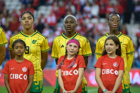 Toronto, ON, Canada - September 26, 2023: Jamaica national football team stands for the national anthem before the 2023 Concacaf W Olympic Play-In match between women national team of Canada and  Jamaica (Score 2:1)のeditorial素材