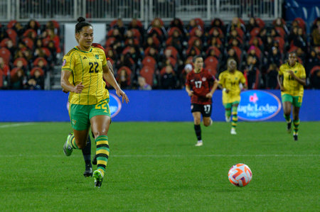 Toronto, ON, Canada - September 26, 2023: Kayla McKenna  #22 of the Jamaica national football team moves with the ball during the 2023 Concacaf W Olympic Play-In match between women national team of Canada and  Jamaica (Score 2:1)のeditorial素材