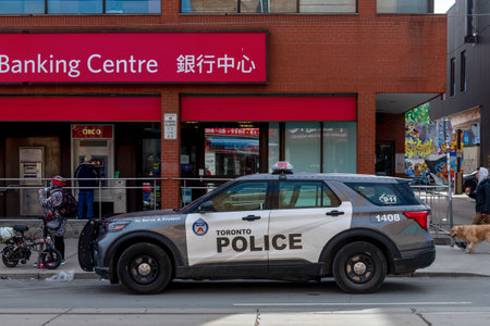 Toronto, ON, Canada - September 4, 2023: A police car patrols the streets of Torontoのeditorial素材