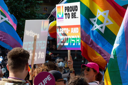 Toronto, ON, Canada â June 26, 2022: Participants hold the banners during the 2022 Annual Pride Parade of Pride Month in Toronto Downtownのeditorial素材