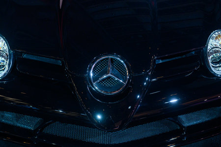 Toronto, ON, Canada - March 15, 2025: A Mercedes-Benz emblem is displayed on the grille of a black luxury car during the Canadian International Auto Show 2025.のeditorial素材