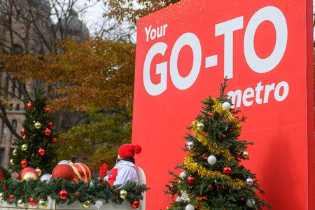 Toronto, ON, Canada - November 23, 2025: The Metro grocery store float, featuring a gingerbread house and festive decorations, travels along the route during the 121st Original Santa Claus Parade.のeditorial素材