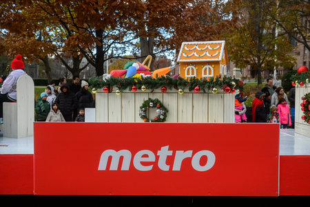 Toronto, ON, Canada - November 23, 2025: The Metro grocery store float, featuring a gingerbread house and festive decorations, travels along the route during the 121st Original Santa Claus Parade.のeditorial素材