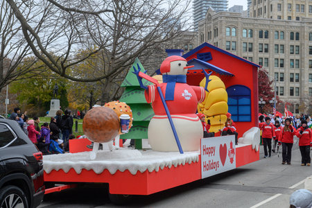Toronto, ON, Canada - November 23, 2025: The Tim Hortons float, featuring a large snowman and...