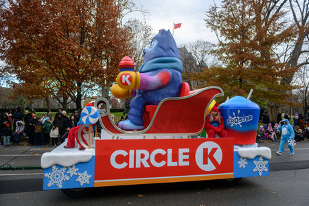 Toronto, ON, Canada - November 23, 2025: The Circle K float, featuring a large mascot riding in a...