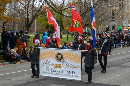 Toronto, ON, Canada â November 23, 2025:  People take part in the 121st Original Santa Claus Parade in Downtown Toronto.のeditorial素材