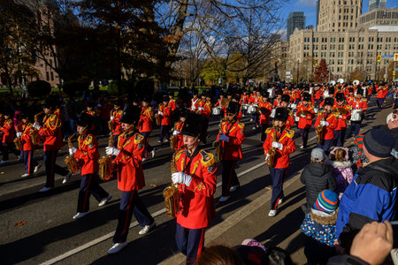 TORONTO, ONTARIO, CANADA - NOVEMBER 23, 2025: The full contingent of a marching band in spectacular...