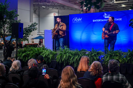Toronto, ON, Canada - November 14, 2025: Audience attending a live musical performance by two guitarists on the Entertainment Stage at The Royal Agricultural Winter Fair eventのeditorial素材