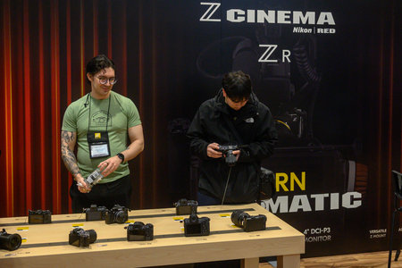 Toronto, ON, Canada - November 6, 2025: People interacting with film and photography equipment on...