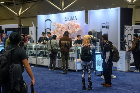 Toronto, ON, Canada - November 6, 2025: Attendees exploring display booths for cameras and lenses,...