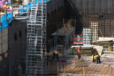 Toronto, ON, Canada - August 3, 2022: A worker works on the construction site of a house under...