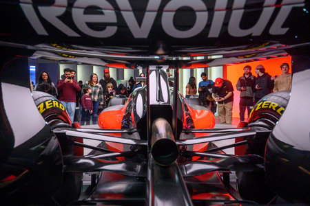 Toronto, ON, Canada - February 14, 2026: Attendees observing a high-performance formula race car on...