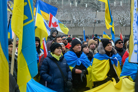 Toronto, ON, Canada â€“ February 22, 2026: People gathering in support of Ukraine, wearing blue...