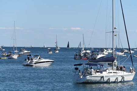 Toronto, ON, Canada - September 3, 2025: Boats sail on a body of water, on a bright, sunny day with...