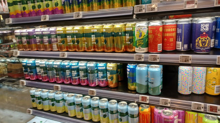 Montreal, QC, Canada - August 1, 2025: A view down a wide, brightly lit aisle in a grocery store...