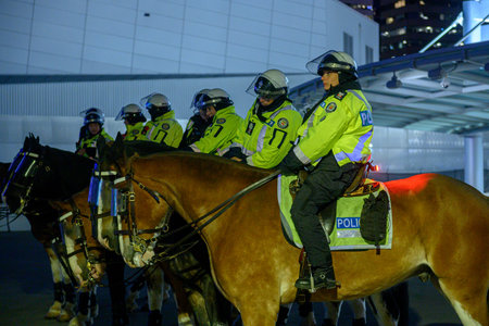 Toronto, ON, Canada - November 11, 2025: Toronto's mounted police unit patrols a Toronto street....