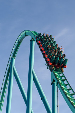 Toronto, ON, Canada - September 30, 2025: A thrilling roller coaster ride ascends into the clear...