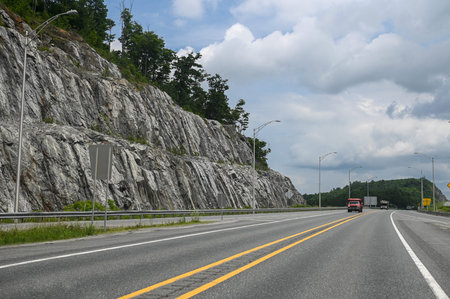 Ontario, Canada - August 10, 2025: This highway runs between rocky cliffs, offering a sense of freedom and travel.のeditorial素材