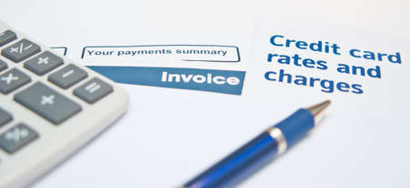Debt situation with credit rates, invoice and calculatorの写真素材