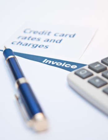 Debt situation with credit rates, invoice and calculatorの写真素材