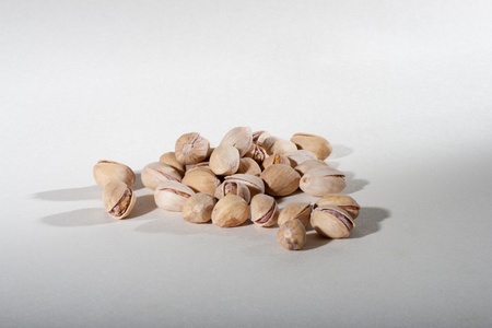 Pistachio nuts in a pileの写真素材