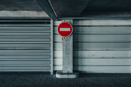 Red and white stop sign on iron wall background.の写真素材