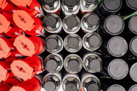 Photo of bottles with construction fluids and materials in a hardware store.の写真素材