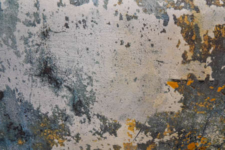 Photo of gray ragged wall.
