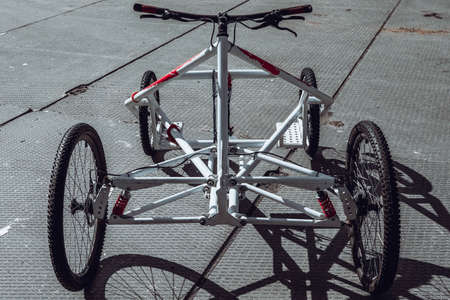 Photo of a bicycle on the road in the city.