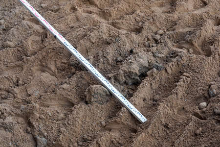 Photo of brown sand and iron stick on the street.の写真素材