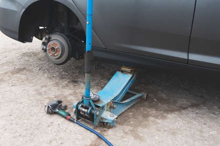 Tire repair balancing and wheel replacement at the stationの写真素材