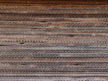 Photo of a large amount of cardboard in production. The texture of the cardboard. High quality photoの写真素材