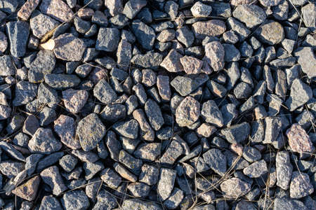 Photo of a large number of stones in different shades of gray. Abstract nature background concept.