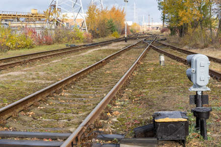 Photo of a railway tracks and green grass. Train and transportation concept.