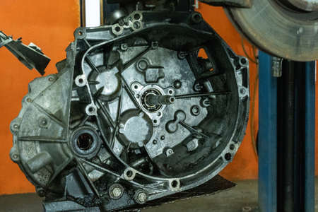 Close-up photo of a car gearbox. Auto garage. Automobile repair.